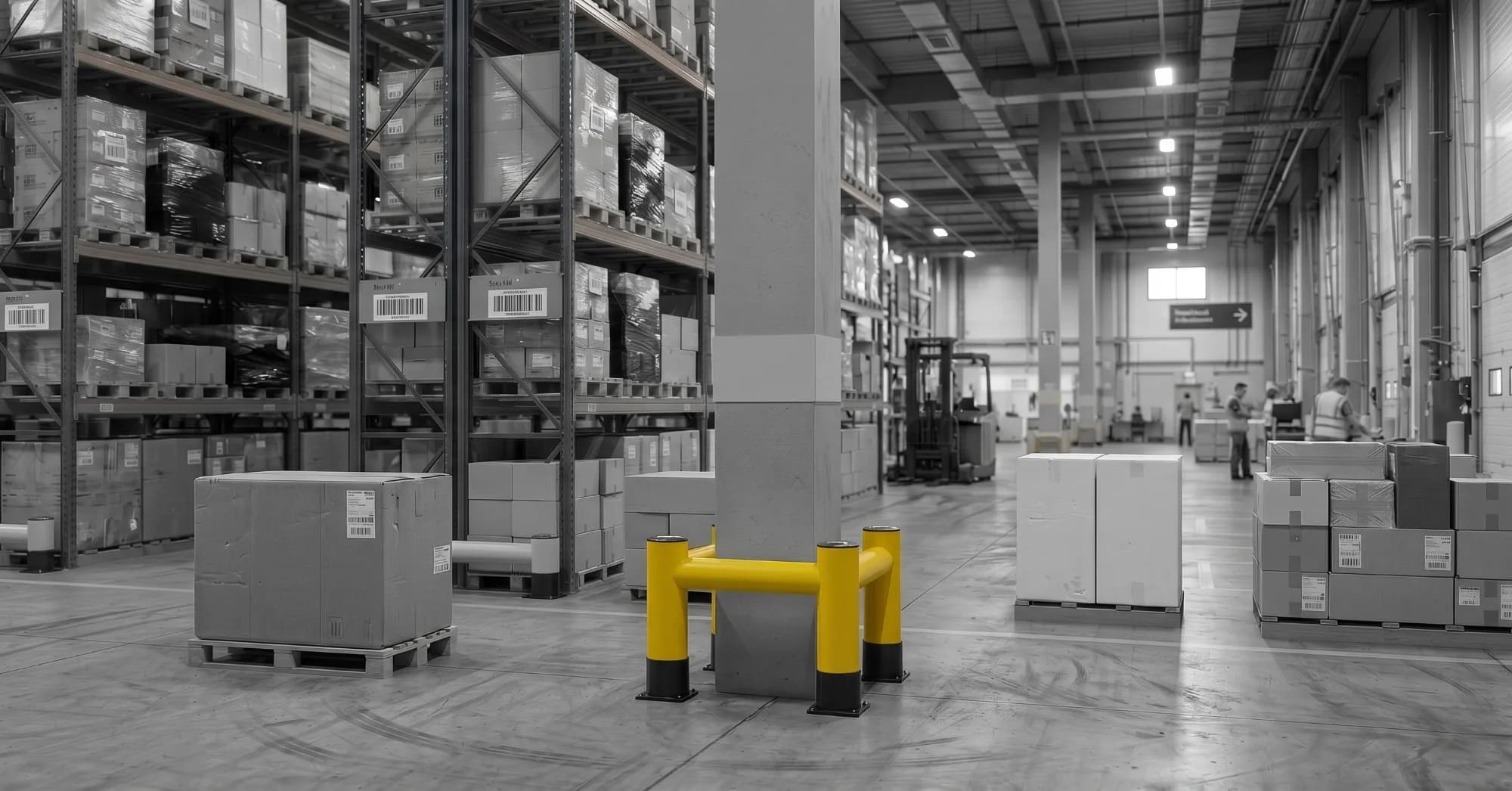 Yellow KK Series column protection barrier fitted around the corners of a concrete column in a warehouse